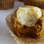 Sourdough Pumpkin Cream Cheese Muffin with a bite taken out